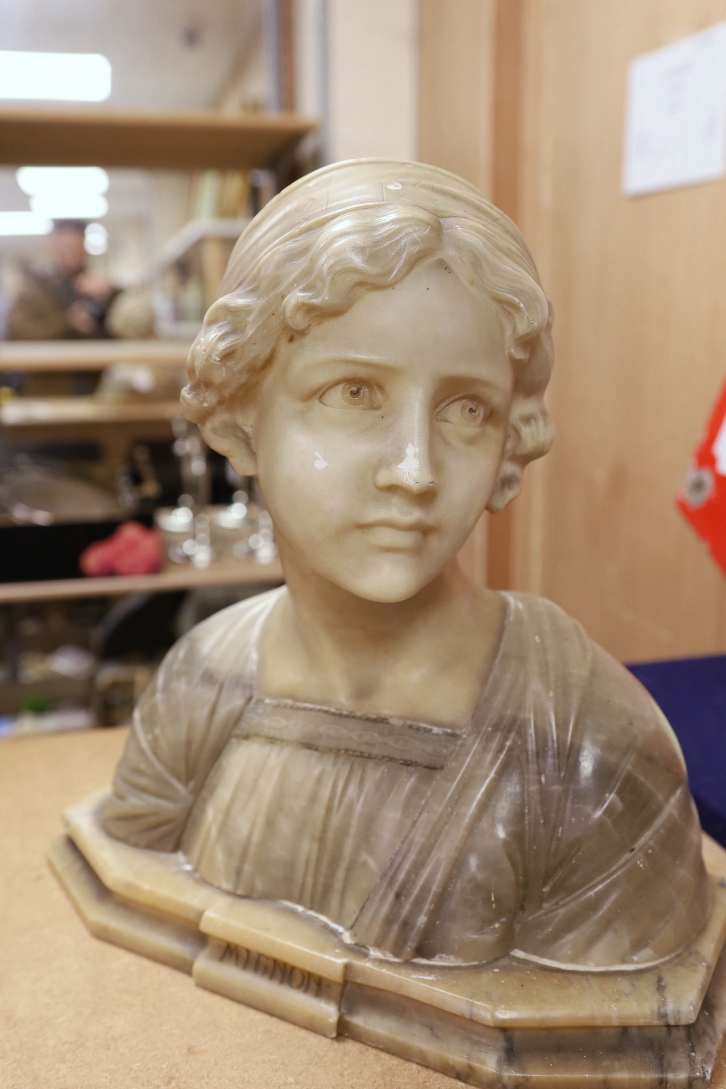 An alabaster bust of a young girl, Mignon, (made in three sections), 38 cms high